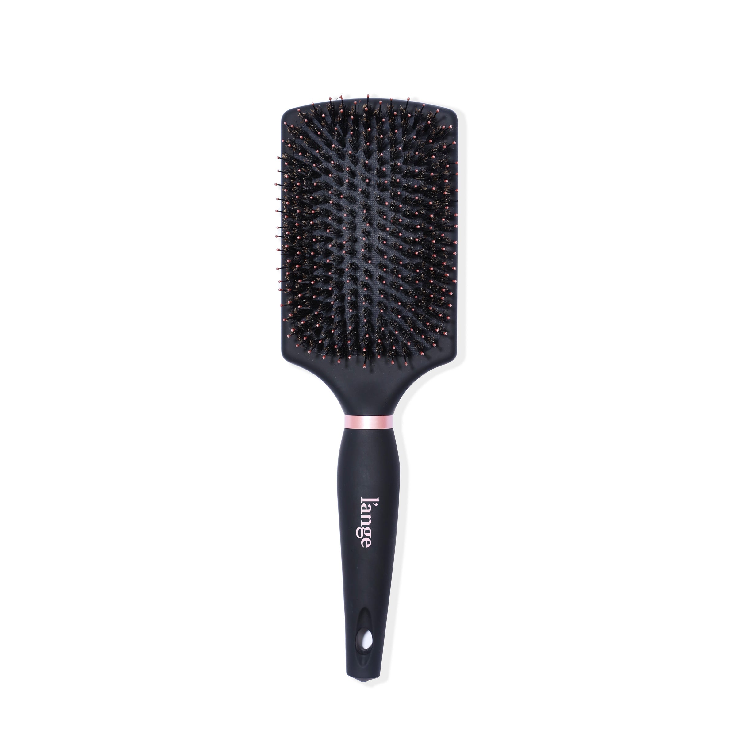 The black boar bristle brush stands vertically so you can see the paddle, logo, & soft-touch handle.