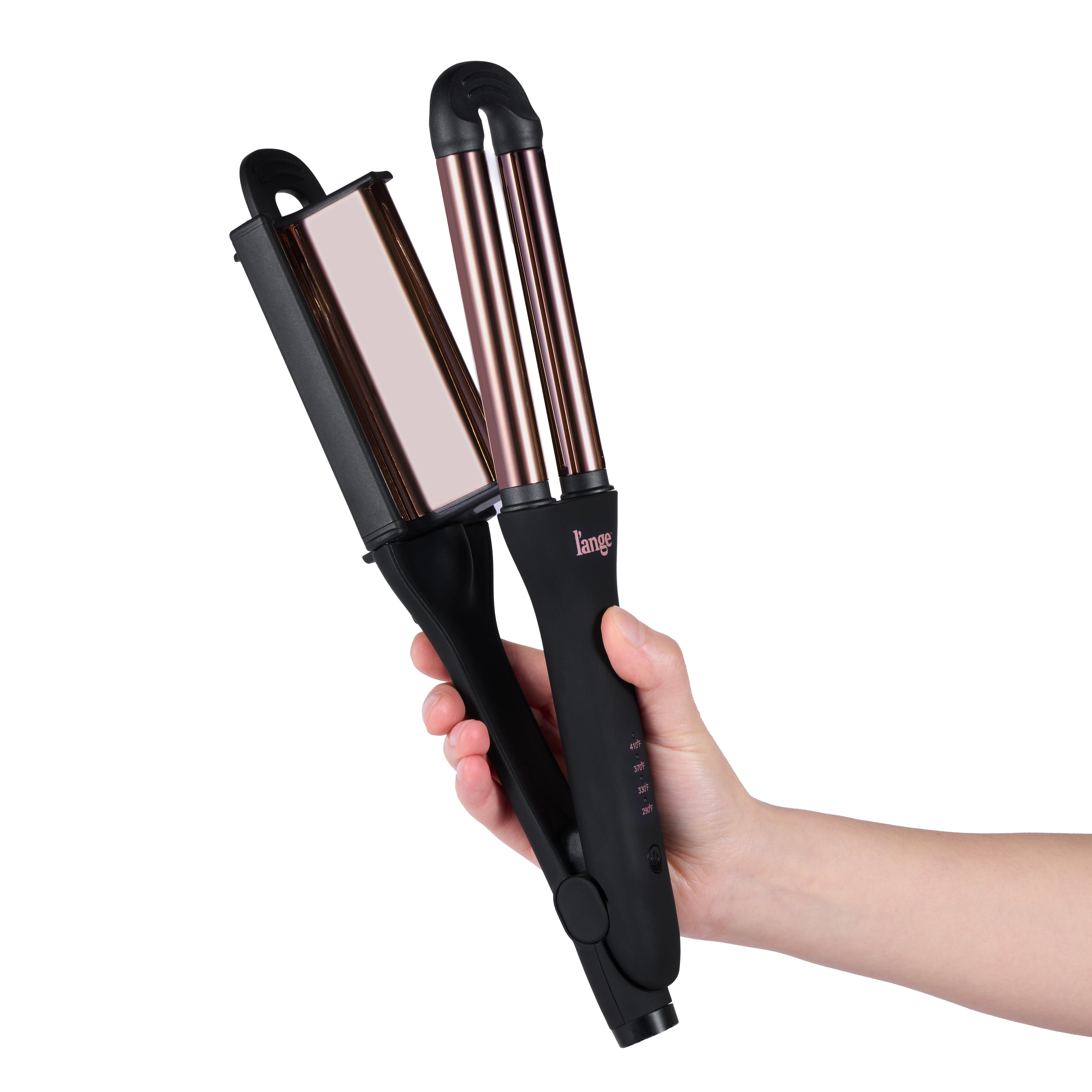 A hand holding a black and rose gold hair styling tool with dual barrels and a flat plate.