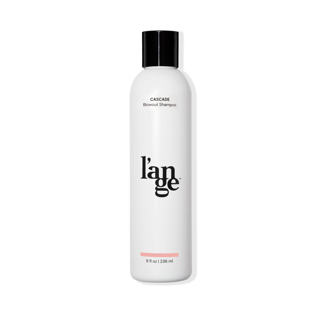 White 8 oz bottle with black font Cascade Blowout Shampoo, black L’ange logo & black cover