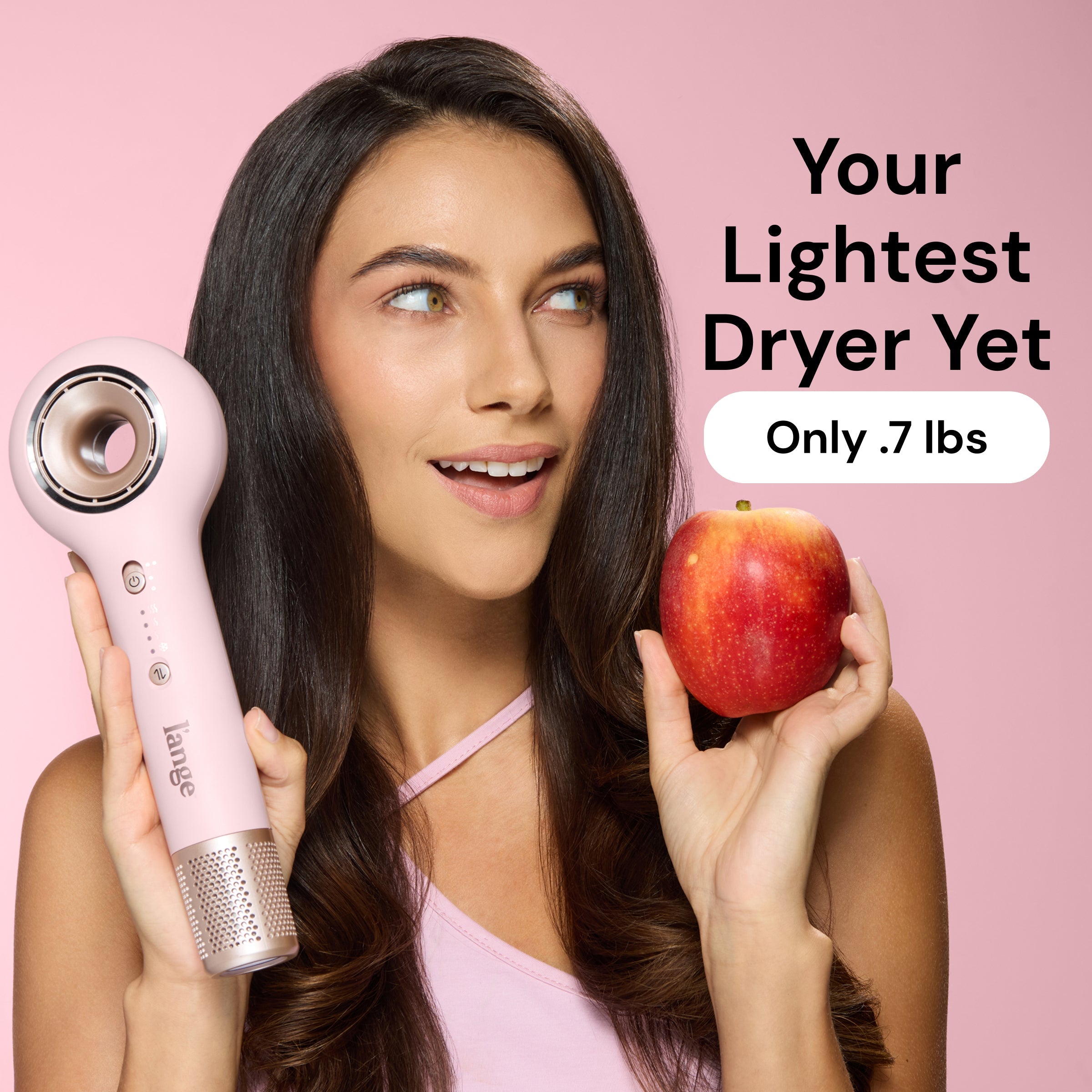 Model holding Axia blush hair dryer and apple. Text reads "Your lightest dryer yet. Oly .7 lbs"