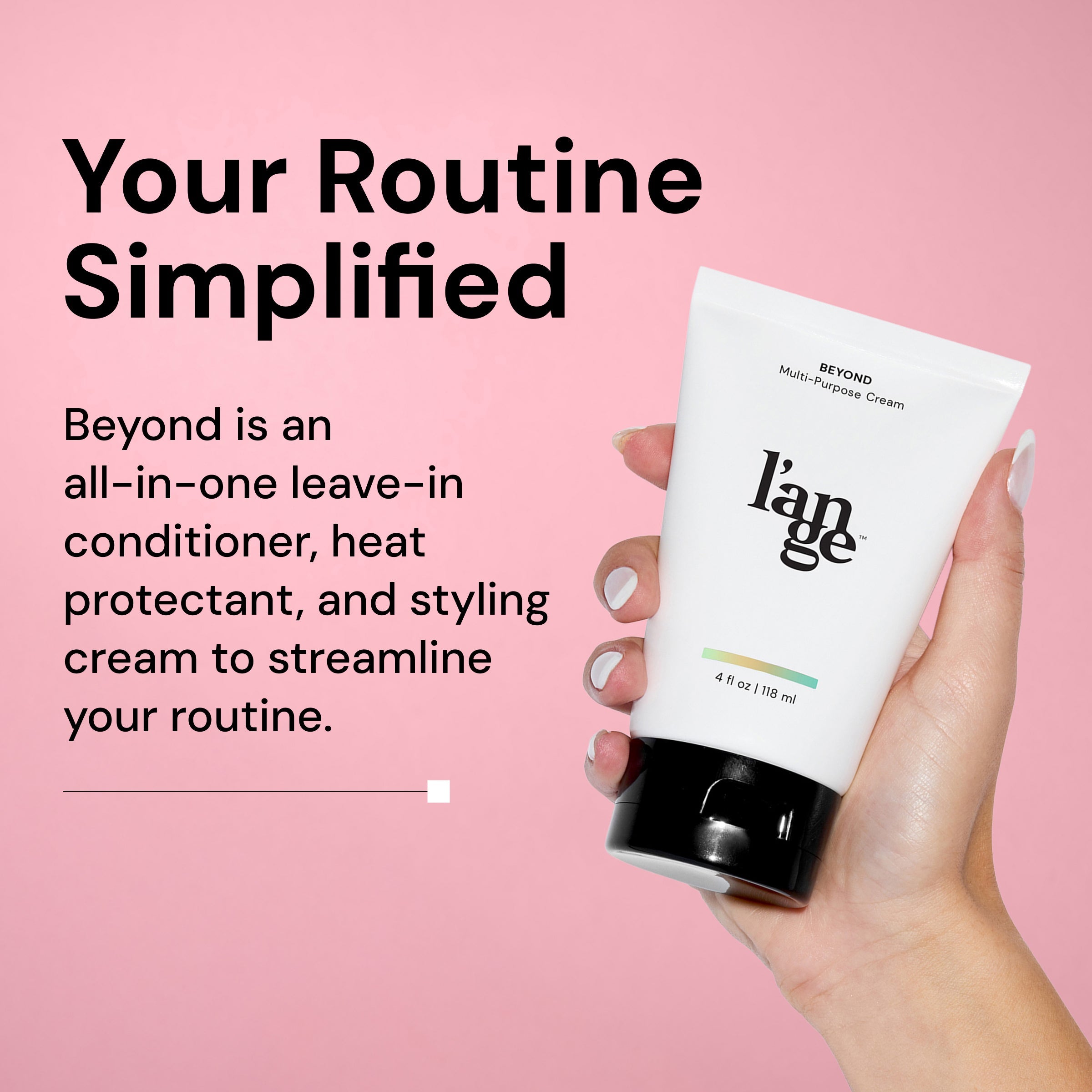 Hand holding a bottle of L’ange Beyond Multi-Purpose Cream against a pink background. Black headline text reads: ‘Your Routine Simplified,’ with a description explaining that Beyond is a leave-in conditioner, heat protectant, and styling cream in one