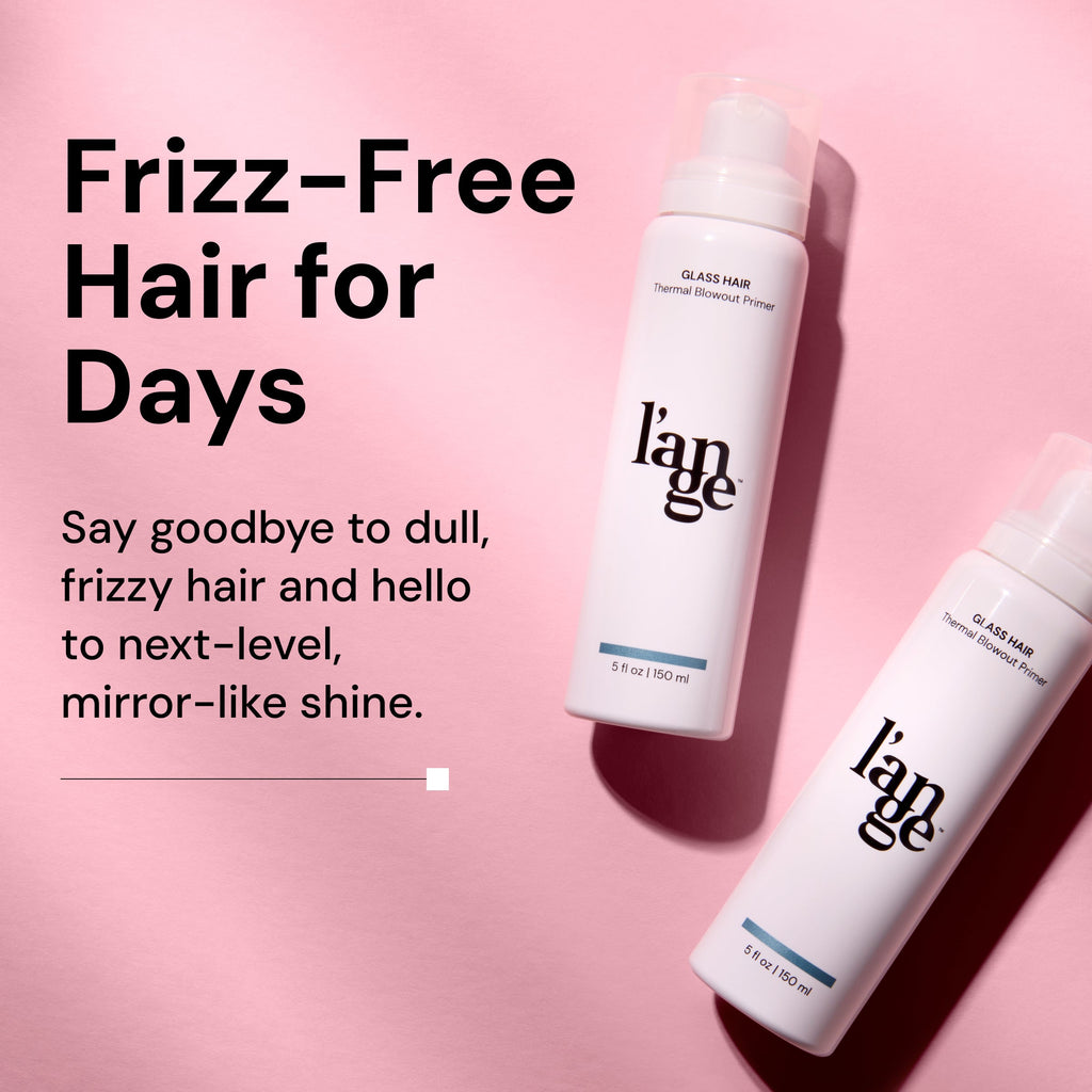 Two white bottles of L’ange Glass Hair Thermal Blowout Primer are placed on a pink background. Bold black text on the left reads “Frizz-Free Hair for Days,” followed by smaller text saying “Say goodbye to dull, frizzy hair and hello to next-level, mirror-like shine.”