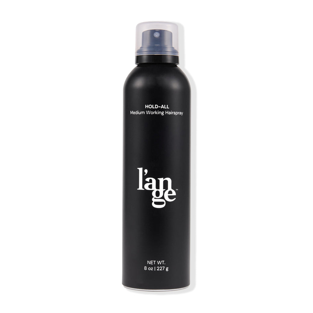 The black bottle of Hold-All Medium Working Hairspray with white print has a clear cap and displays the 8 oz net weight.