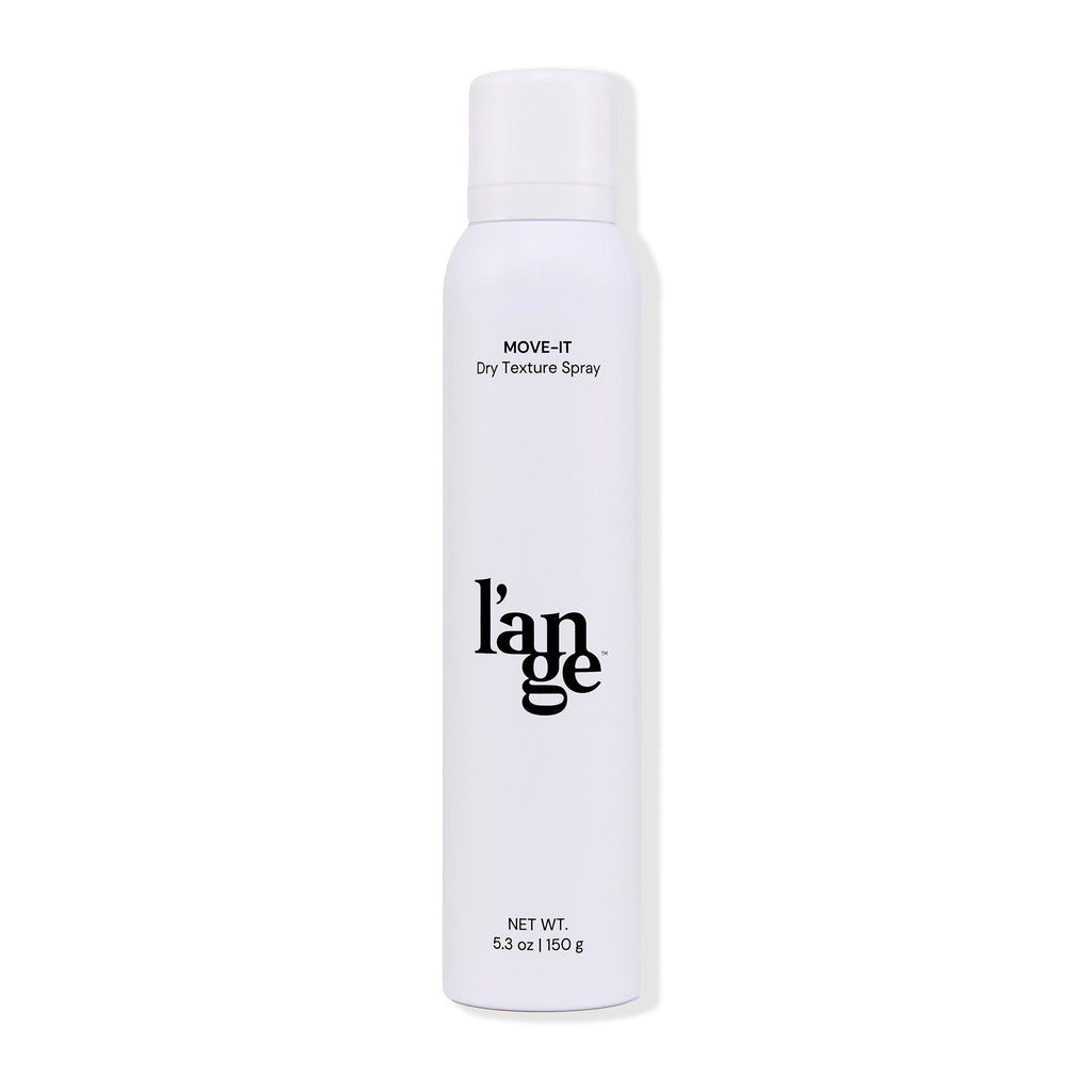 The white bottle with black lettering of Move-It Dry Texture Spray has a clear cap and displays the 5.3 oz net weight.