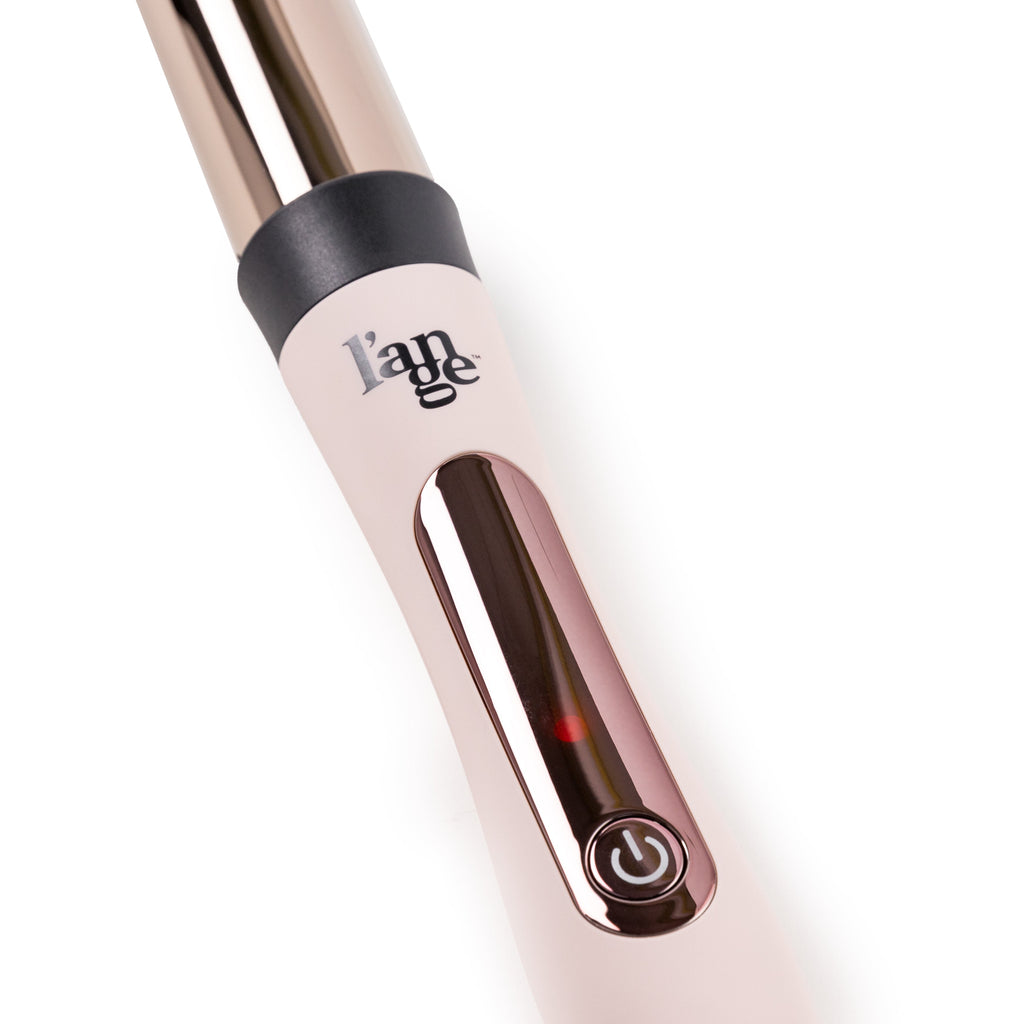 Zoomed in view of blush 32mm titanium barrel with soft touch ergonomic handles & rose gold power button