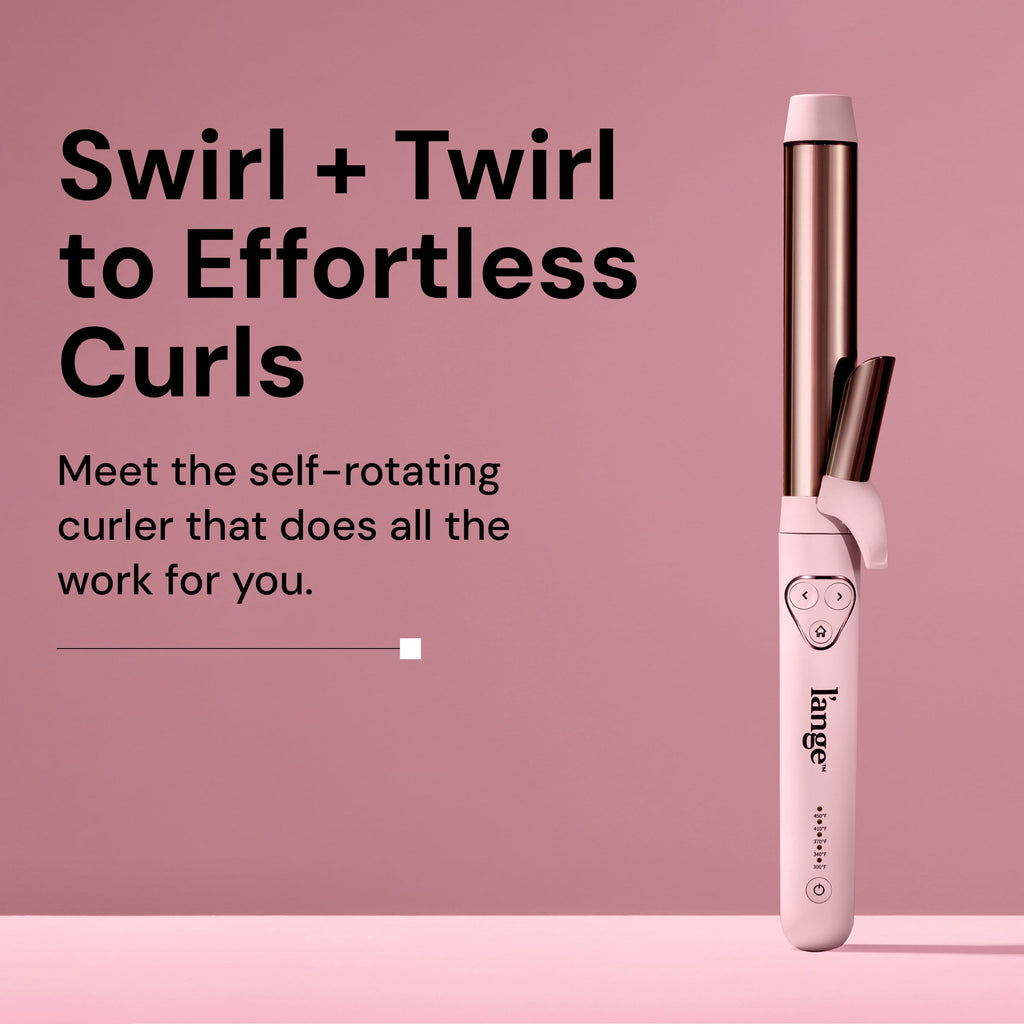 Self-rotating curling iron with a sleek design, offering effortless styling with automated functionality against a soft pink background.