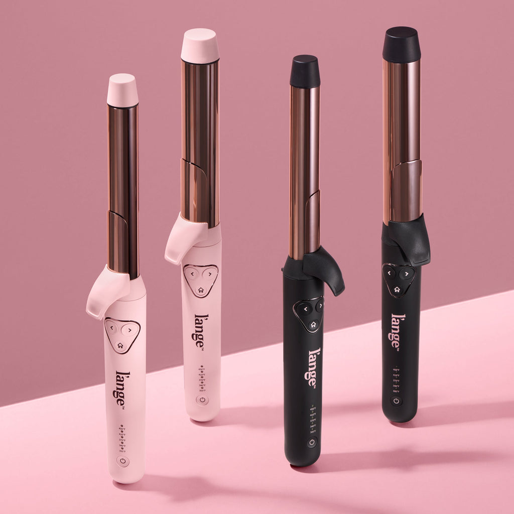 Four sleek curling irons featuring a combination of pink and black handles with rose gold barrels, displayed on a pink background.