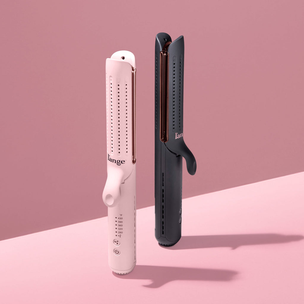Two sleek, modern hair styling tools in pink and black, showcasing adjustable temperature controls and ergonomic design against a soft pink background.