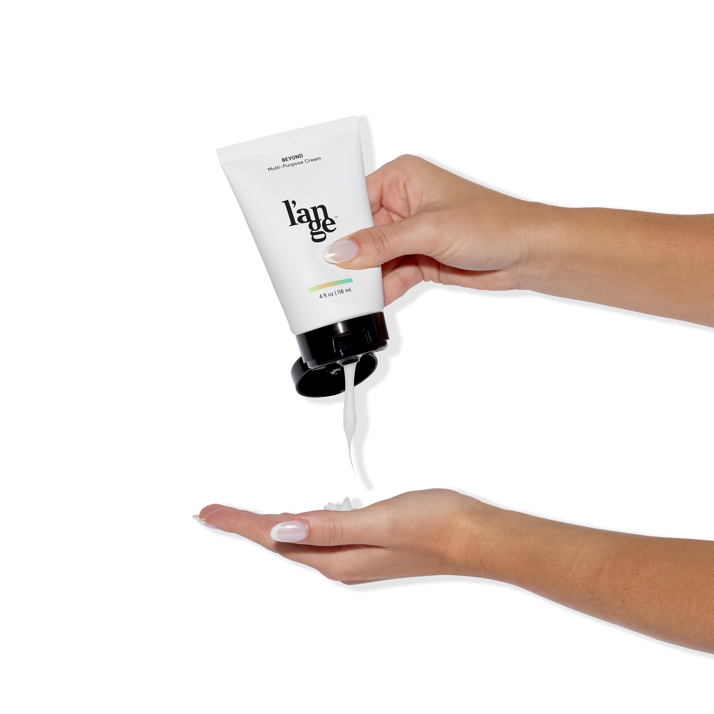 A model squeezing product out of the Beyond Multi-Purpose Cream bottle unto her palm.