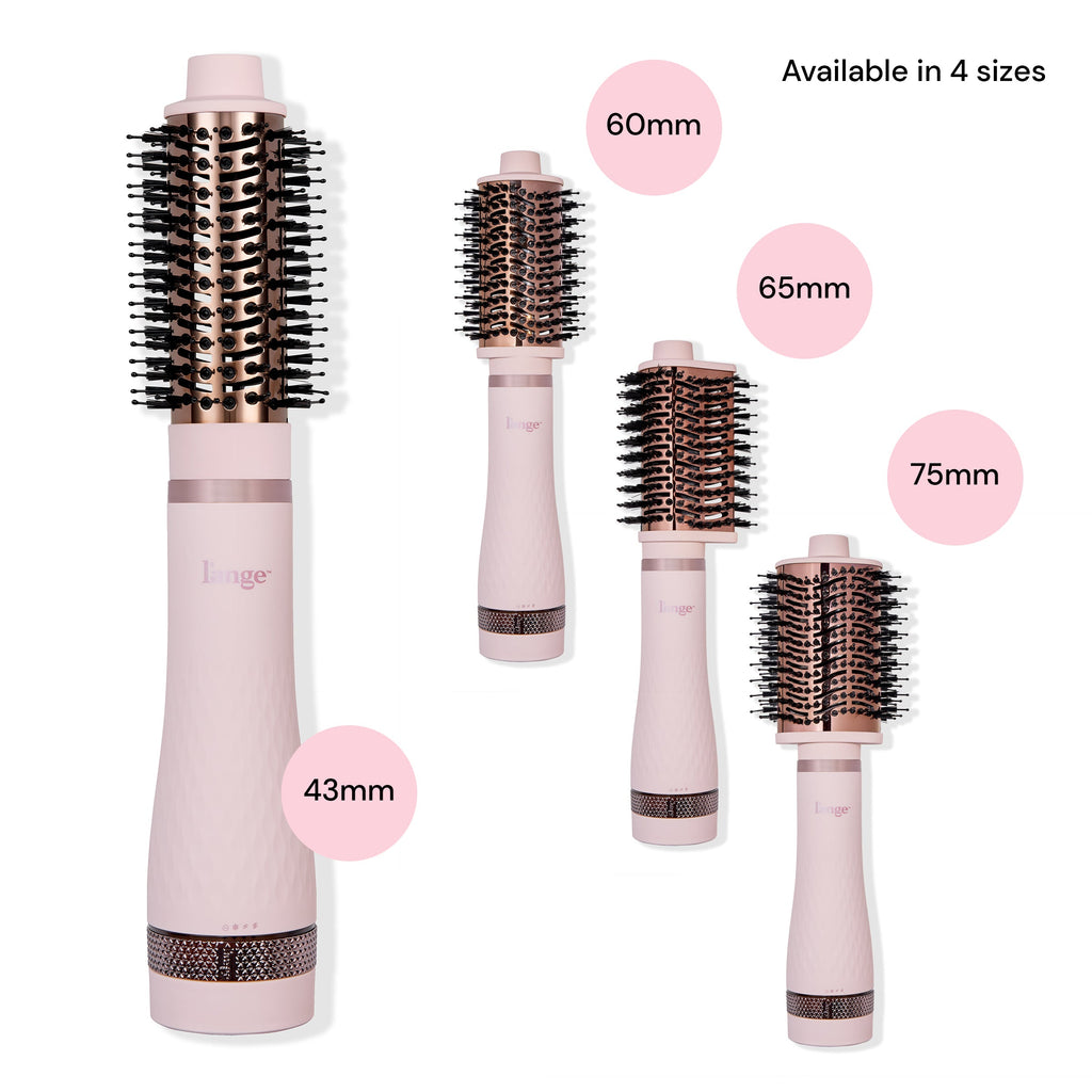 The 4 different interchangeable brush head attachments for Multi-Volume Series sit next to the assembled brush dryer.