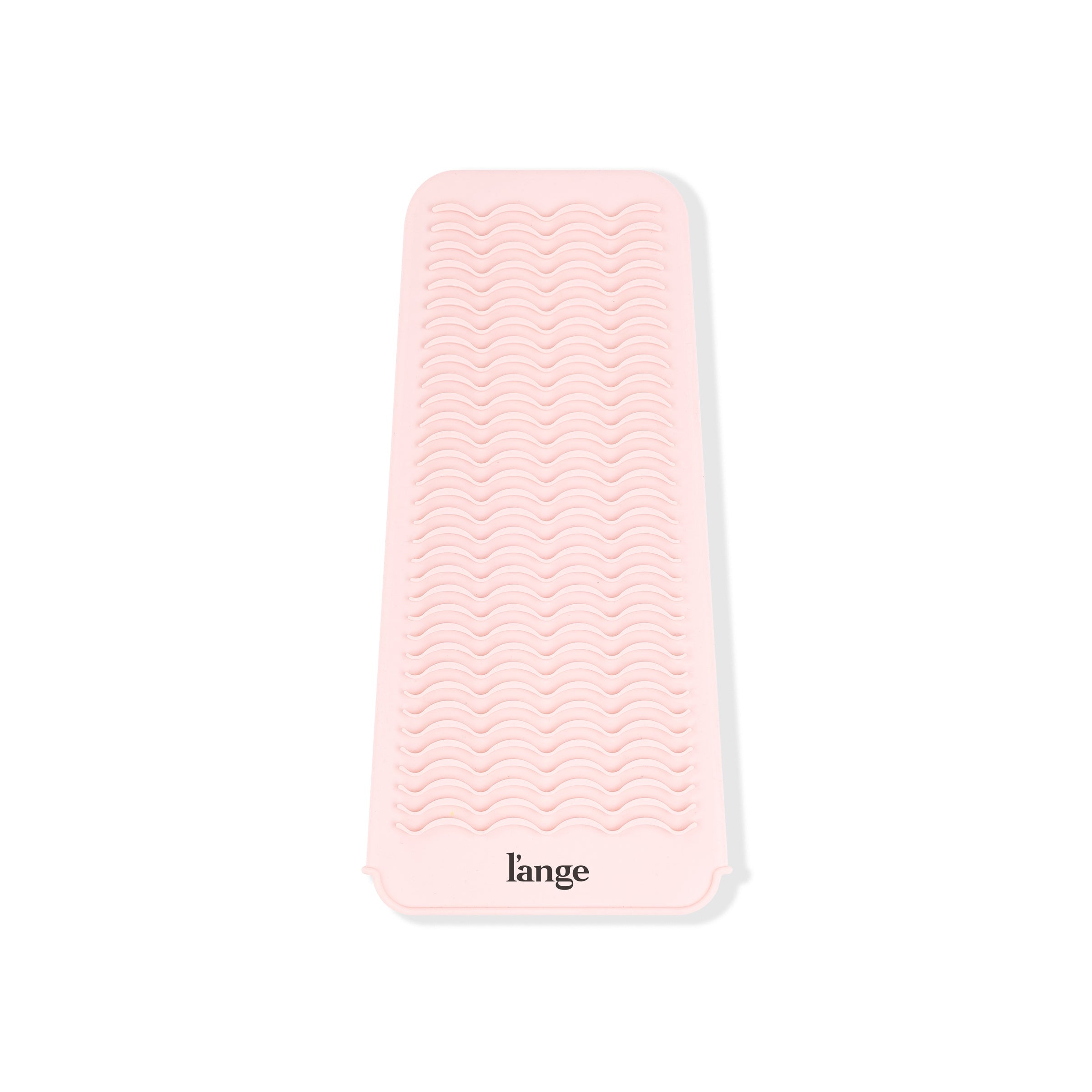 You can see the rippled, slip-resistant, silicone surface of the curling iron mat for hot tools.