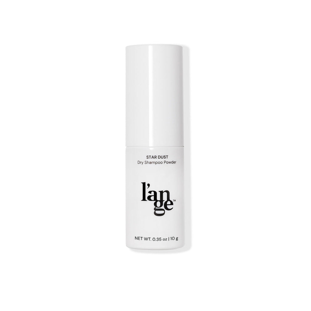 White cylindrical bottle labeled "l’ange Star Dust Dry Shampoo Powder," net weight 0.35 oz (10 g).