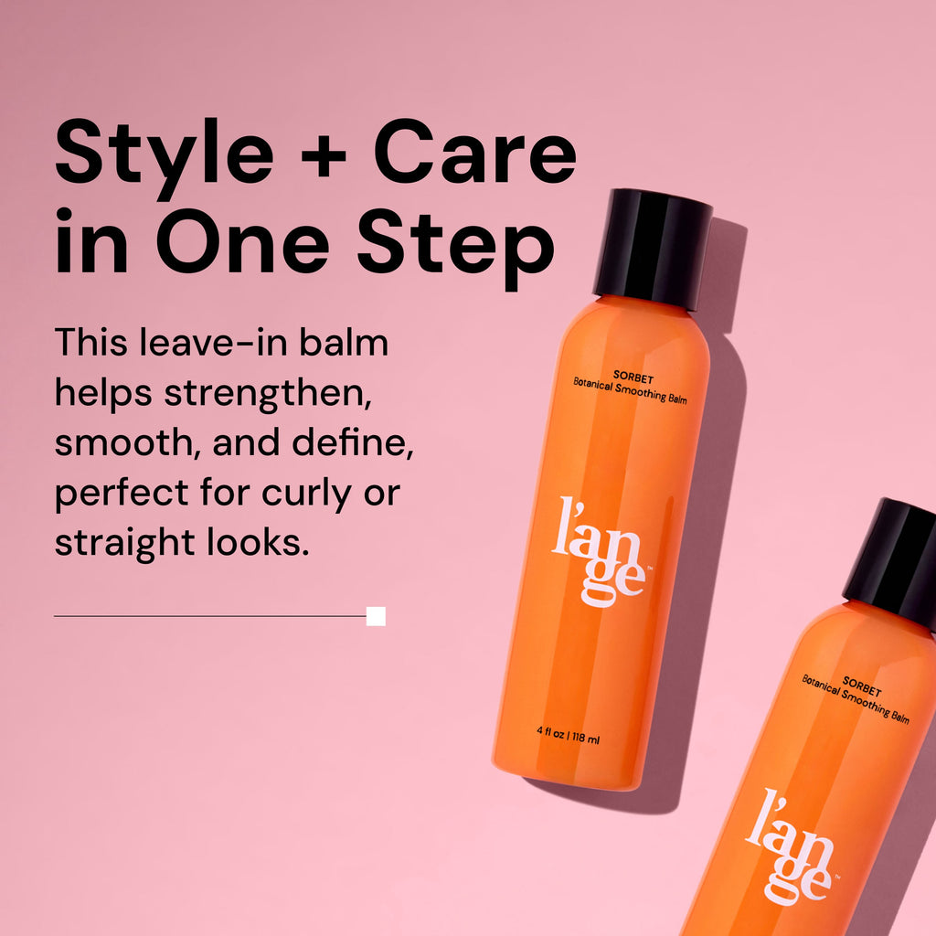 A bottle of L’ange Sorbet Botanical Smoothing Balm lies diagonally on a pink background with a shadow. The orange bottle is labeled 4 fl oz (118 ml). On the left, bold text reads: 'Style + Care in One Step.' Below, smaller text states: 'This leave-in balm helps strengthen, smooth, and define, perfect for curly or straight looks.